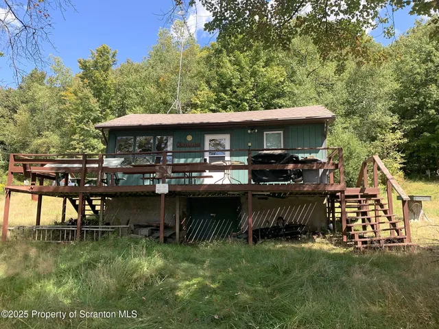 a view of a chair and table in the patio