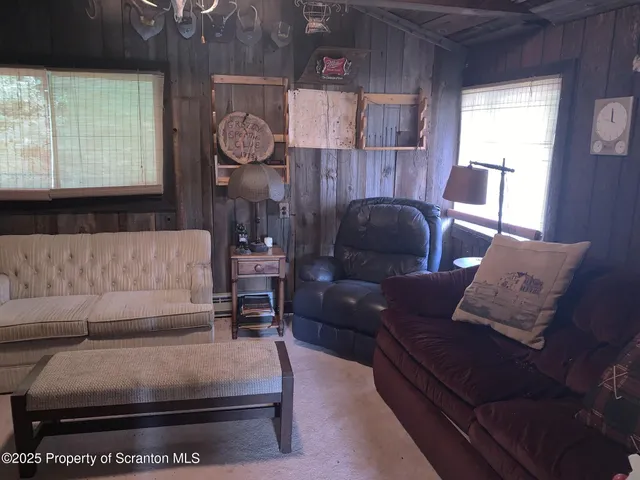 a living room with furniture and a window