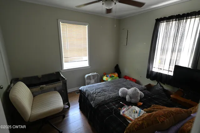 a living room with furniture rug and window
