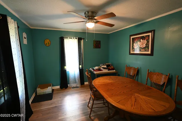 a blue room with furniture and a window