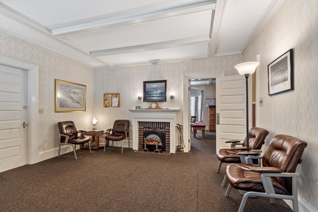 741 Salem Street Lynnfield, MA 01940 - Photo 15 of 41 a living room with furniture and a fireplace
