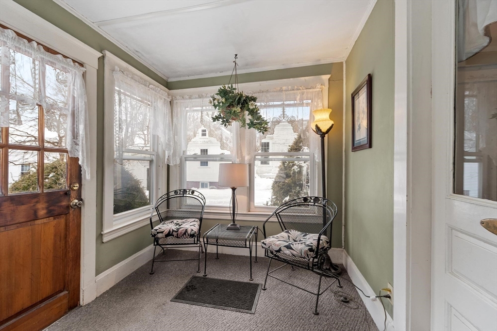 741 Salem Street Lynnfield, MA 01940 - Photo 18 of 41 a living room with furniture and a chandelier
