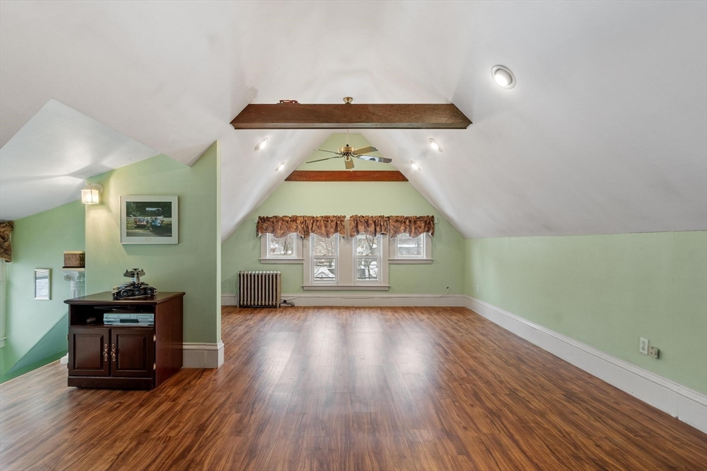 741 Salem Street Lynnfield, MA 01940 - Photo 23 of 41 a view of a room with wooden floor windows and a fireplace