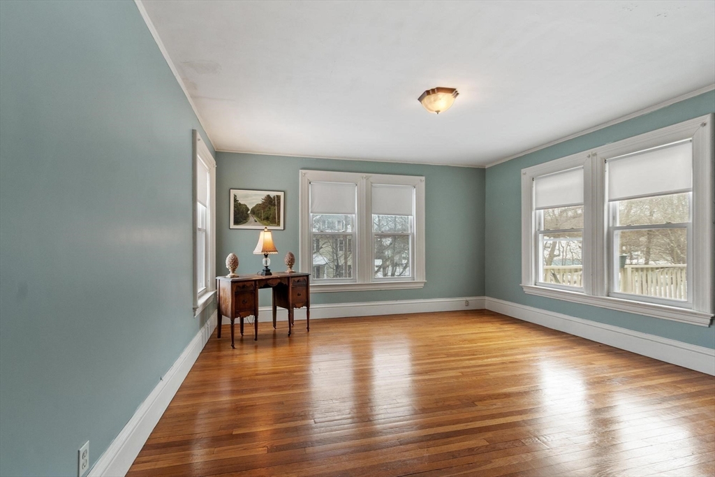 741 Salem Street Lynnfield, MA 01940 - Photo 26 of 41 a view of a livingroom with furniture hardwood floor and workspace