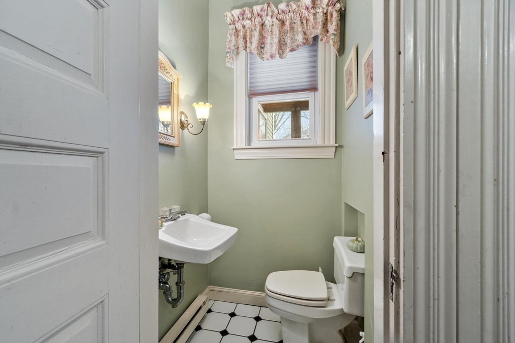 741 Salem Street Lynnfield, MA 01940 - Photo 29 of 41 a bathroom with a toilet a sink and a mirror