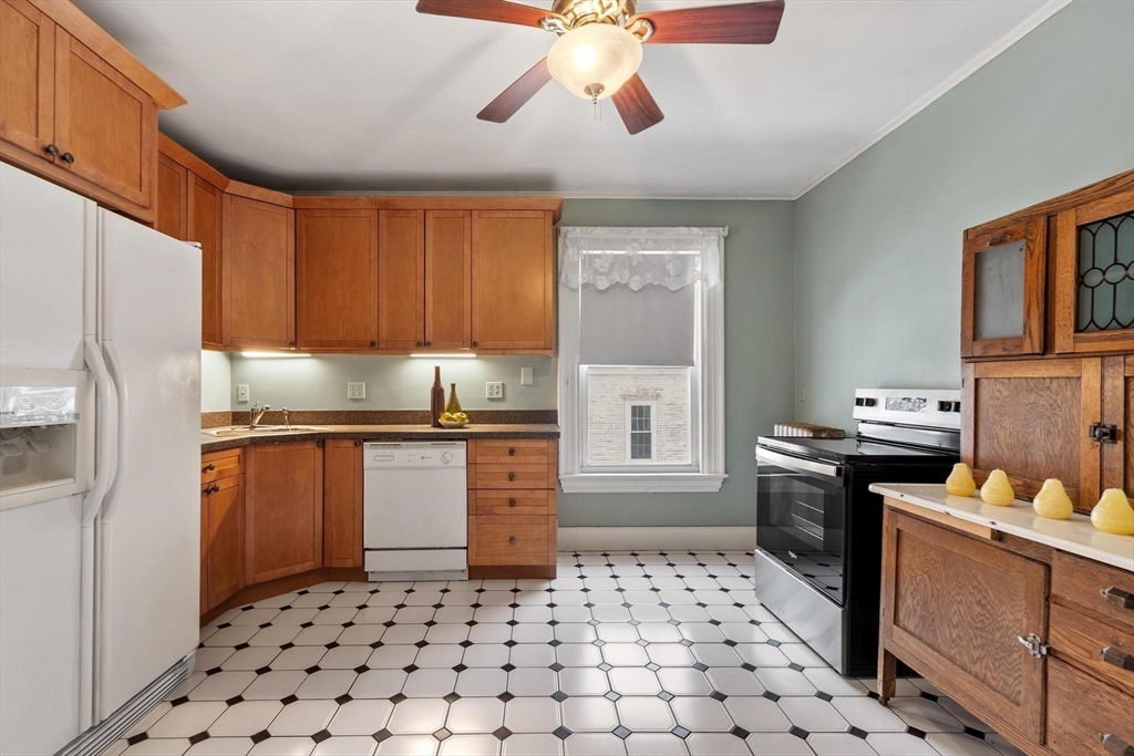 741 Salem Street Lynnfield, MA 01940 - Photo 6 of 41 a kitchen with stainless steel appliances a stove a sink and a refrigerator