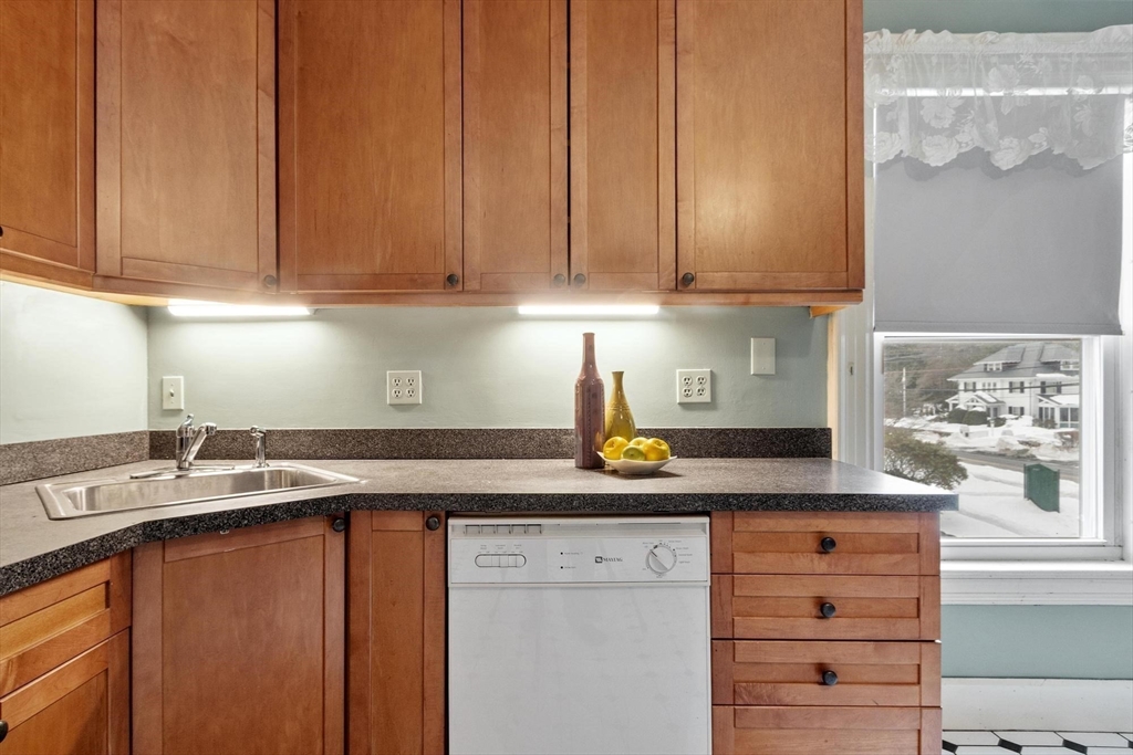 741 Salem Street Lynnfield, MA 01940 - Photo 8 of 41 a kitchen with stainless steel appliances granite countertop a sink a stove and cabinets