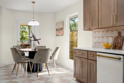 a dining room with furniture and window