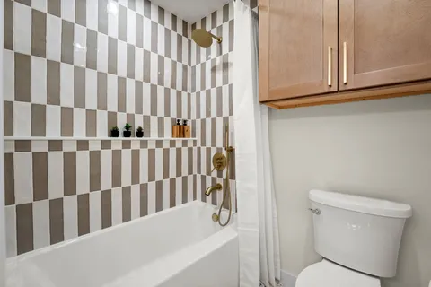 a bathroom with a toilet and a sink