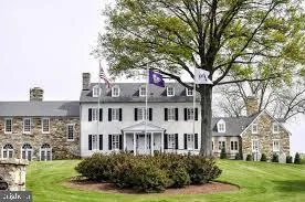 a front view of a building with garden