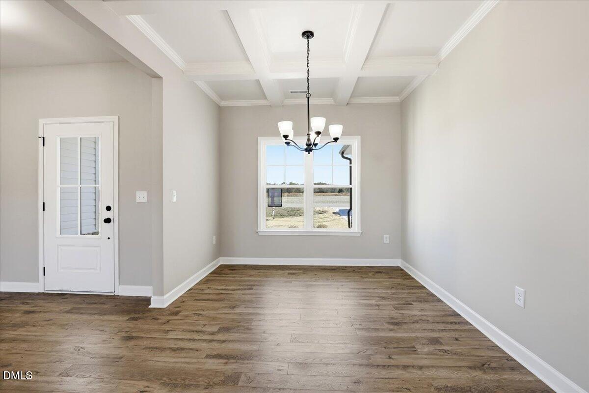 3696 Drew Farmer Road La Grange, NC 28551 - Photo 14 of 35 a view of an empty room with wooden floor and a window
