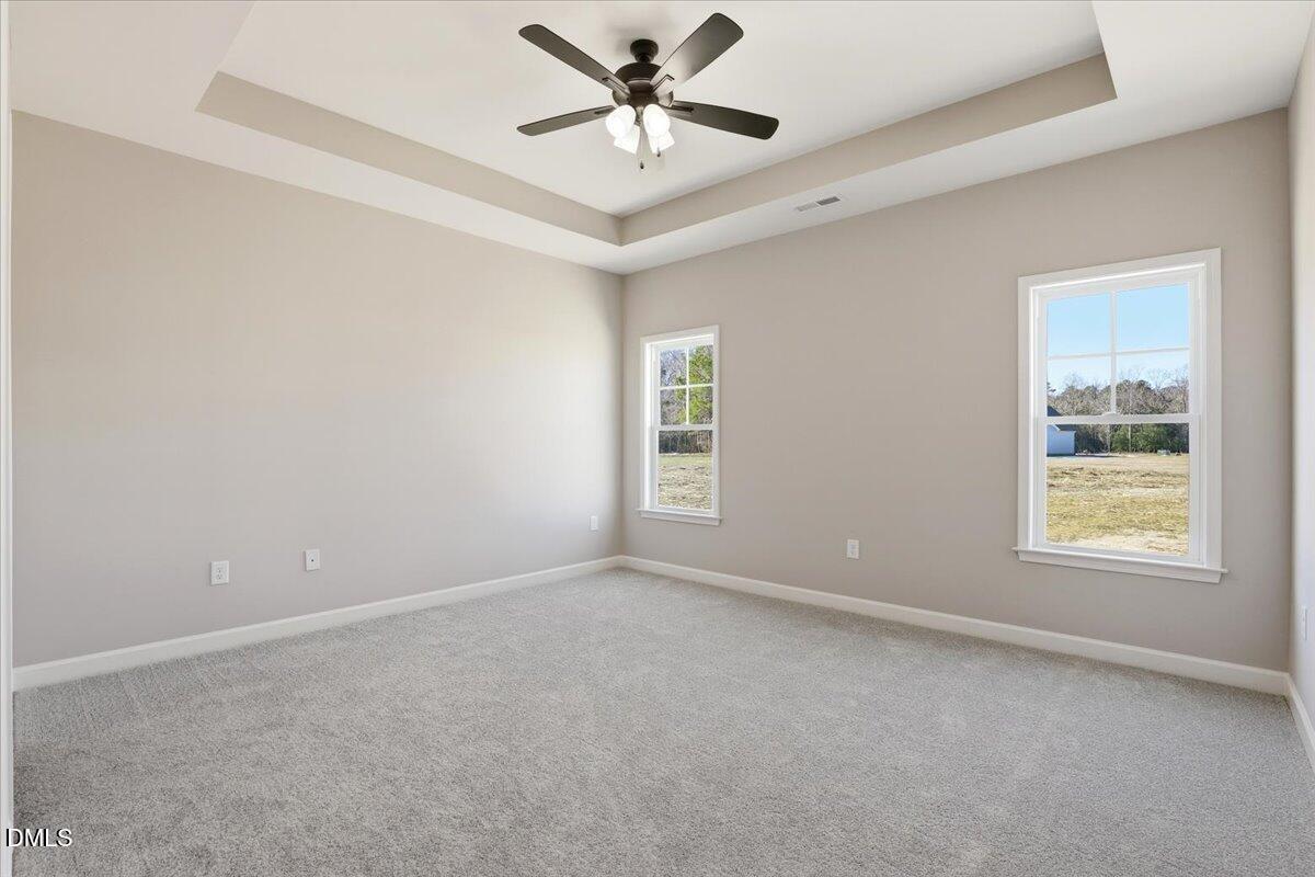 3696 Drew Farmer Road La Grange, NC 28551 - Photo 16 of 35 an empty room with a window and a ceiling fan