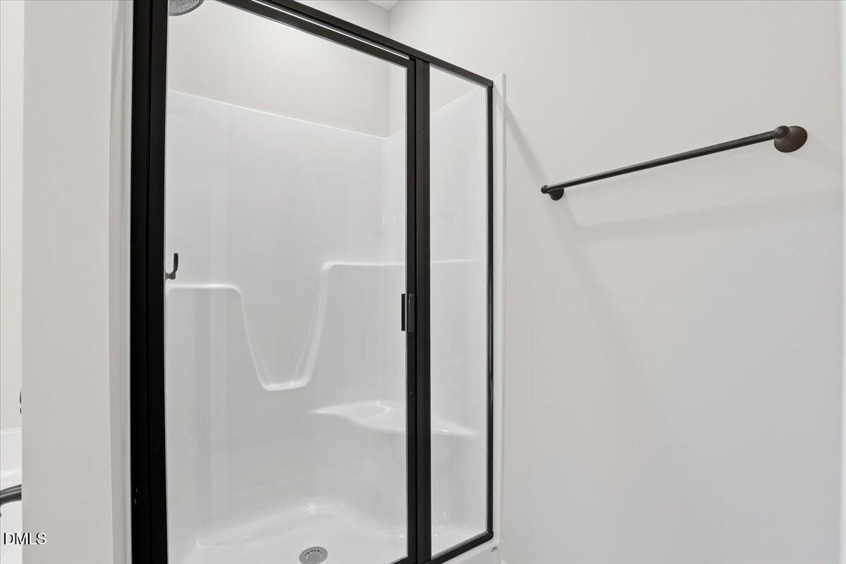 3696 Drew Farmer Road La Grange, NC 28551 - Photo 24 of 35 a bathroom with a glass shower door