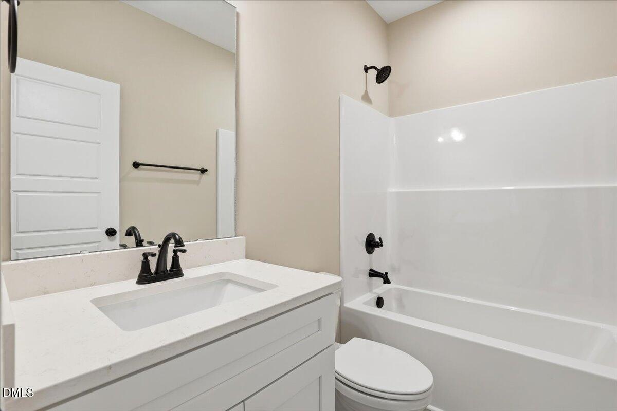 3696 Drew Farmer Road La Grange, NC 28551 - Photo 25 of 35 a bathroom with a sink a toilet and a tub