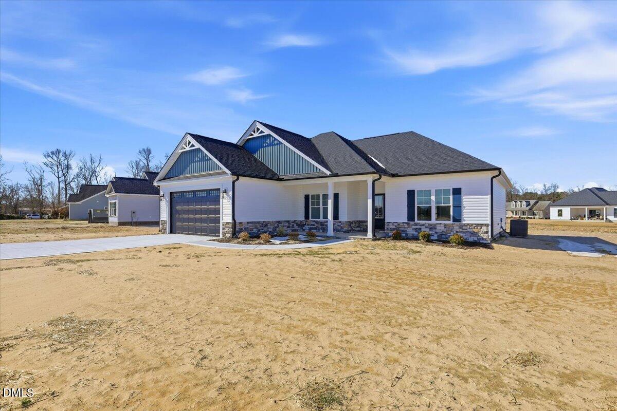 3696 Drew Farmer Road La Grange, NC 28551 - Photo 3 of 35 a front view of a house with a yard covered with snow in front of it