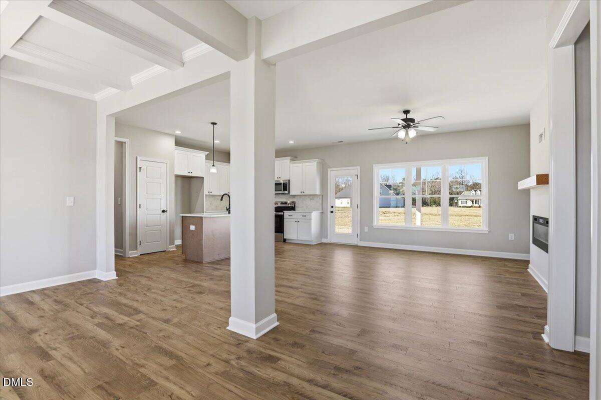 3696 Drew Farmer Road La Grange, NC 28551 - Photo 4 of 35 a view of a big room with wooden floor and a kitchen