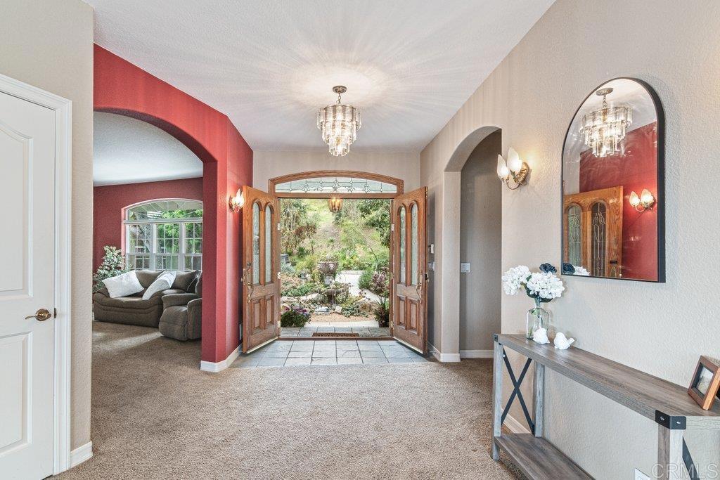 4327 Hollyhill Road Vista, CA 92084 - Photo 8 of 73 Entry with doors open to Welcome the Outsude In