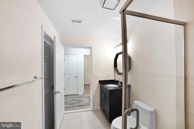 a bathroom with a toilet and a sink