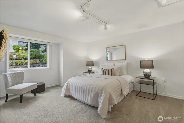 a bedroom with a bed and a couch