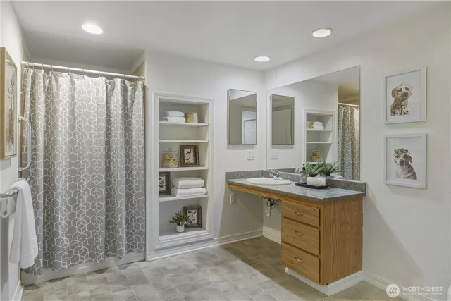 a room with a cabinets and a table