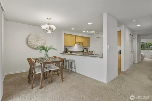 a kitchen with a table and chairs in it