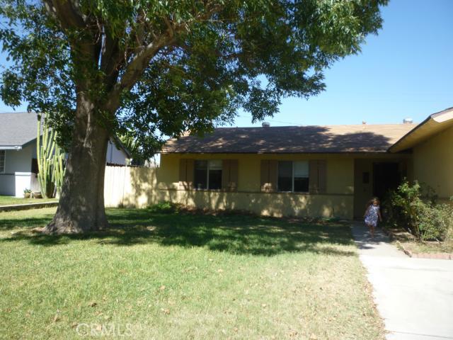 5651 Bolivar Street Riverside, CA 92505 - Photo 1 of 1 a front view of a house with garden
