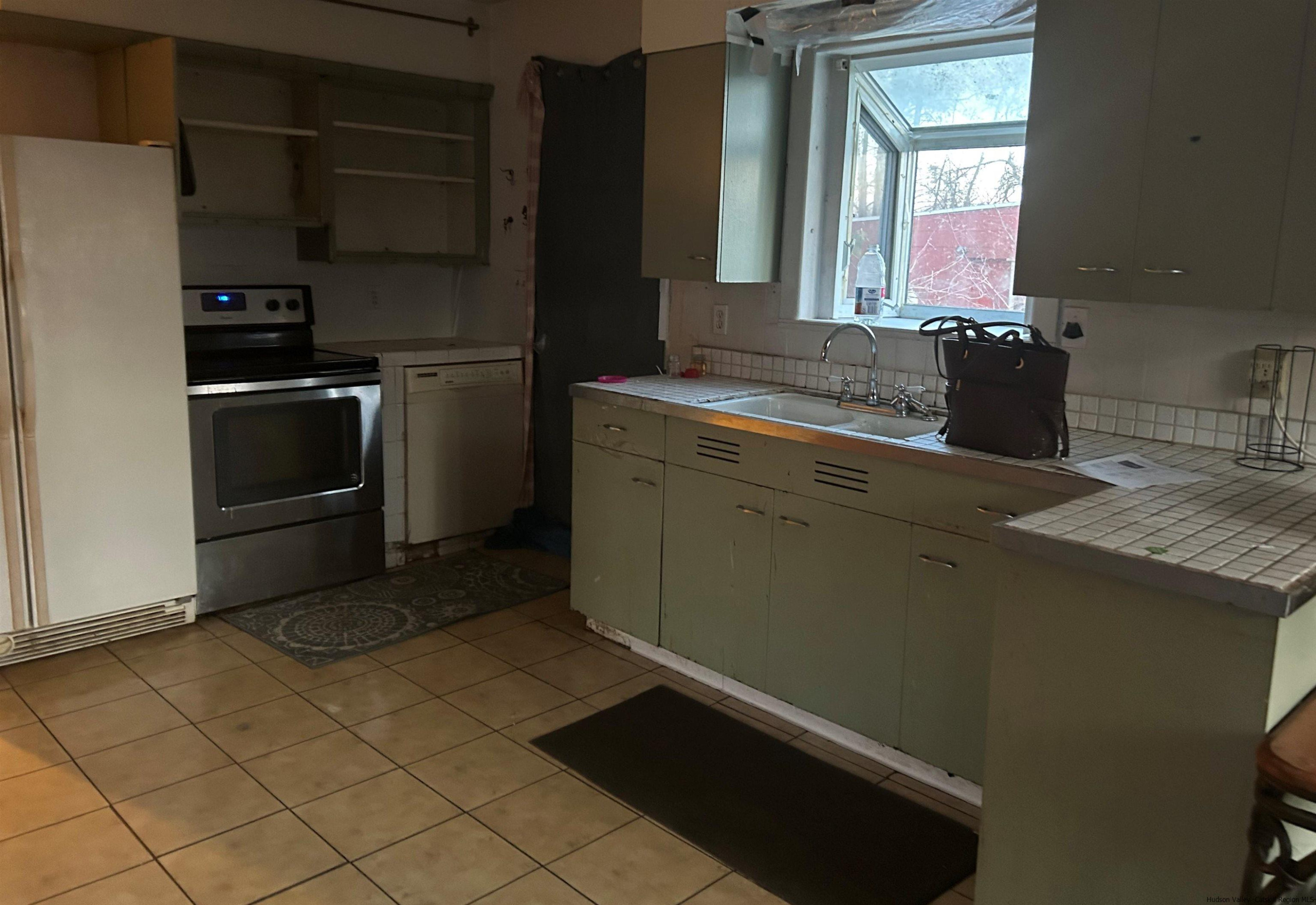 485 Red Top Road Highland, NY 12528 - Photo 5 of 9 a kitchen with a refrigerator and a sink
