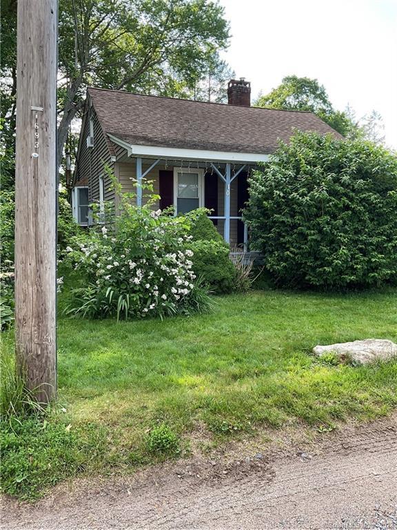 10 N Road Bolton, CT 06043 - Photo 1 of 1 a front view of a house with garden