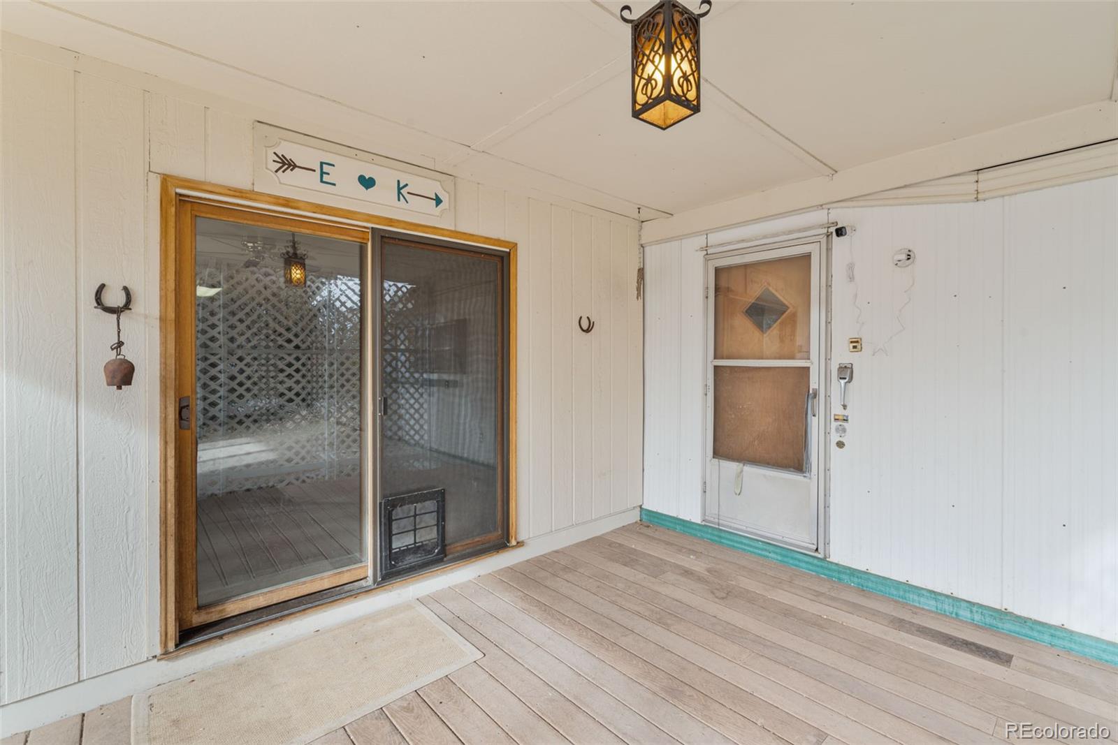 149 North 3rd Street Hayden, CO 81639 - Photo 12 of 41 a view of a hallway with wooden floor and a bathroom