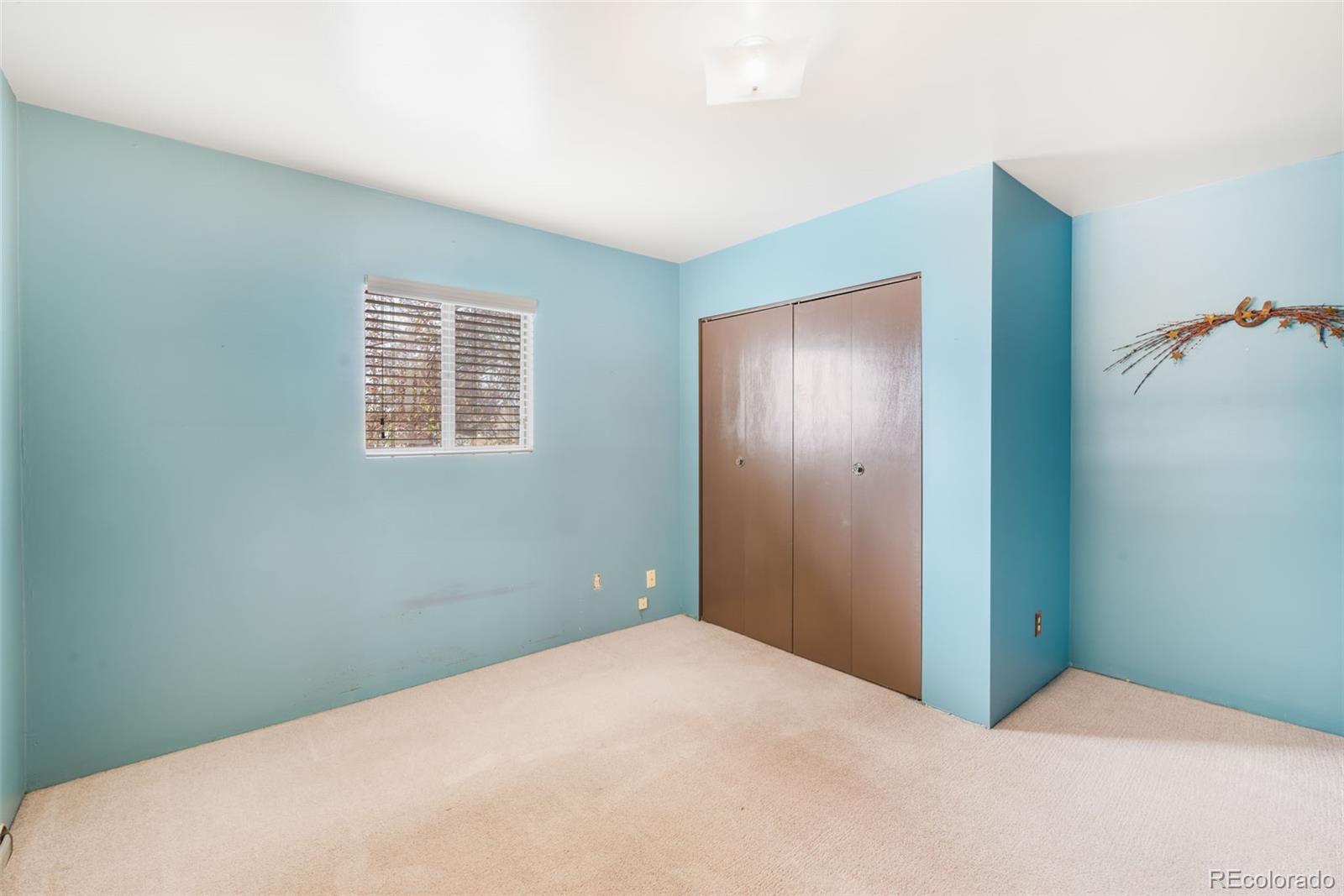 149 North 3rd Street Hayden, CO 81639 - Photo 27 of 41 a bedroom with a bed and a window
