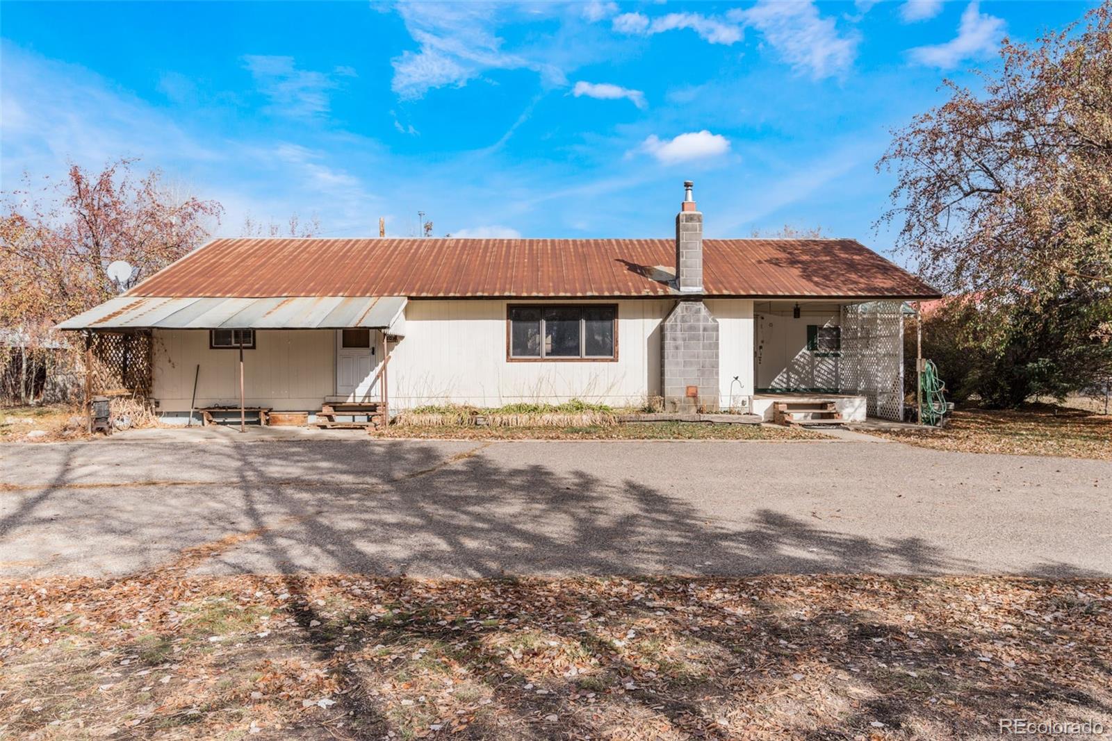 149 North 3rd Street Hayden, CO 81639 - Photo 5 of 41 a front view of a house with a yard