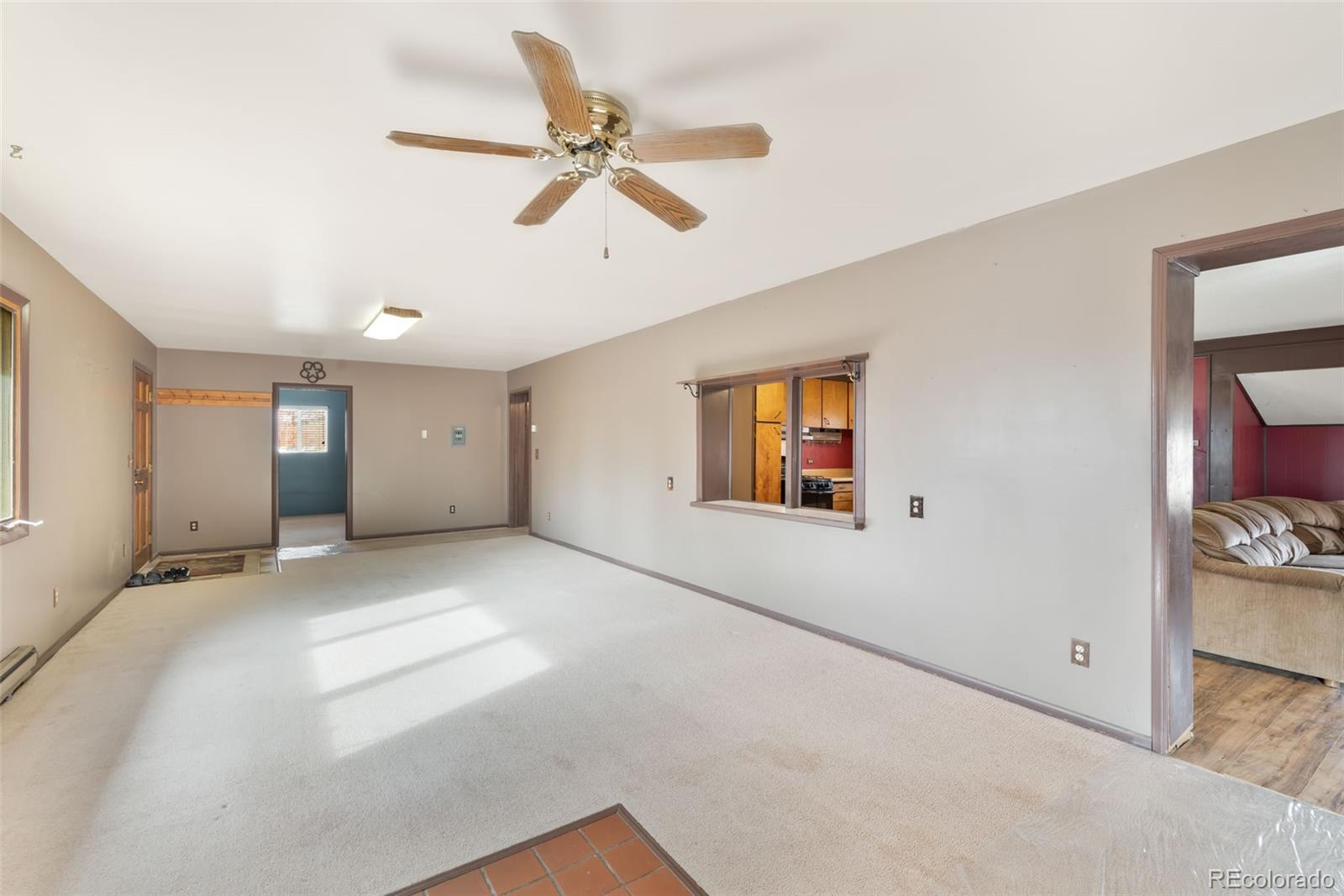149 North 3rd Street Hayden, CO 81639 - Photo 8 of 41 a view of a livingroom with a ceiling fan and window