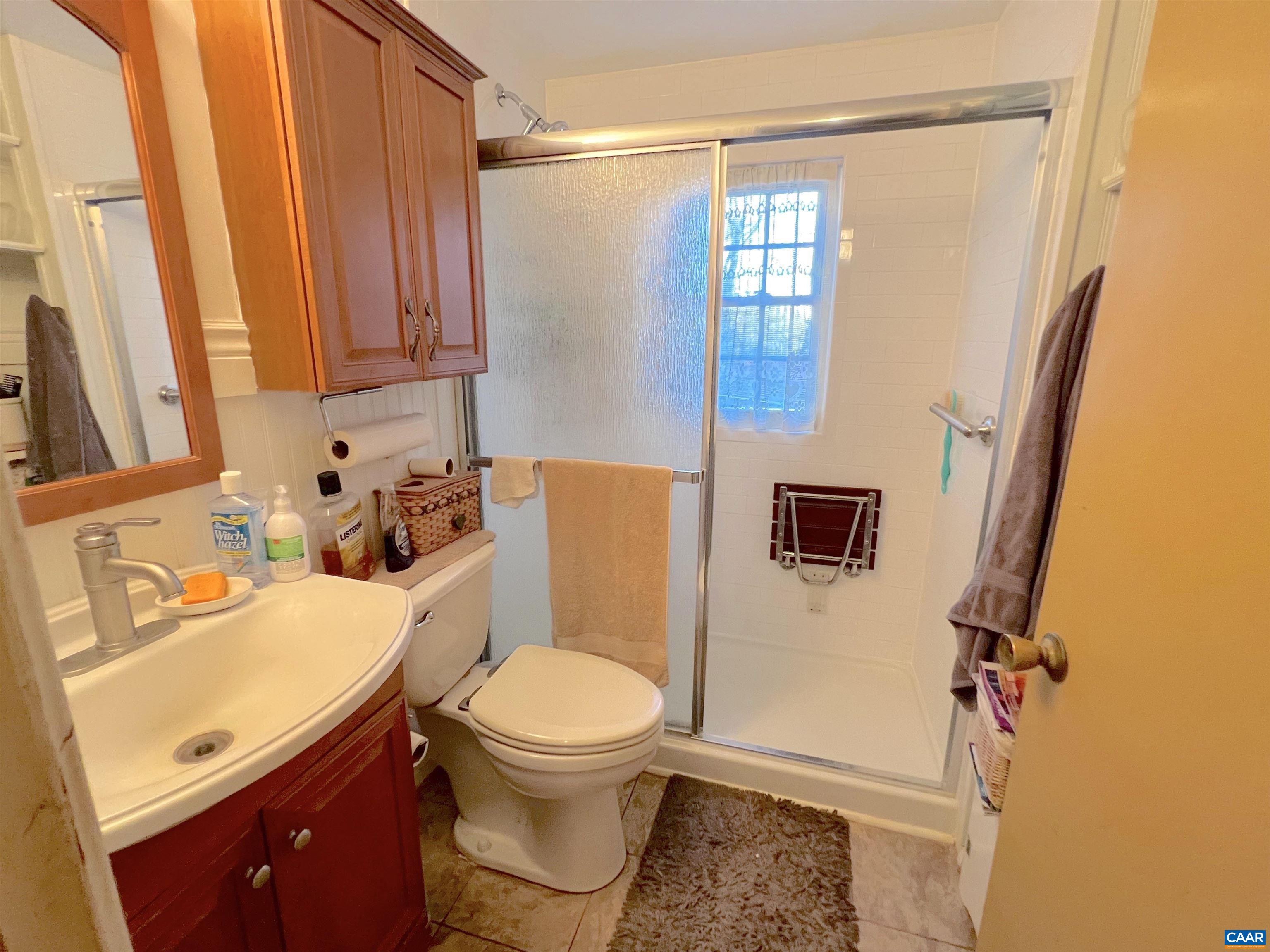 71 North Frontage Road Madison, VA 22727 - Photo 32 of 73 a bathroom with a sink a toilet and shower curtain