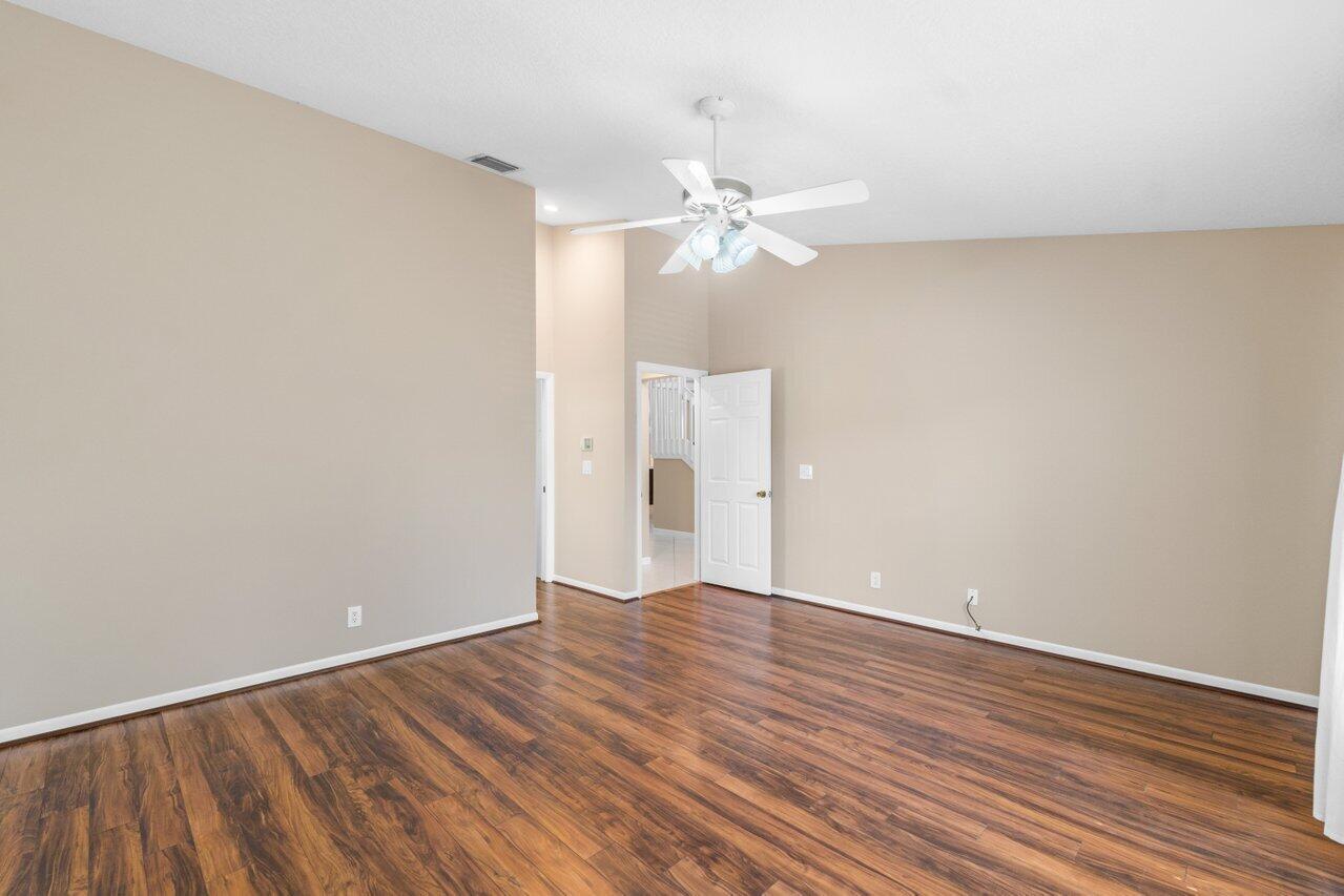 23458 Torre Circle Boca Raton, FL 33433 - Photo 16 of 36 a view of an empty room with wooden floor