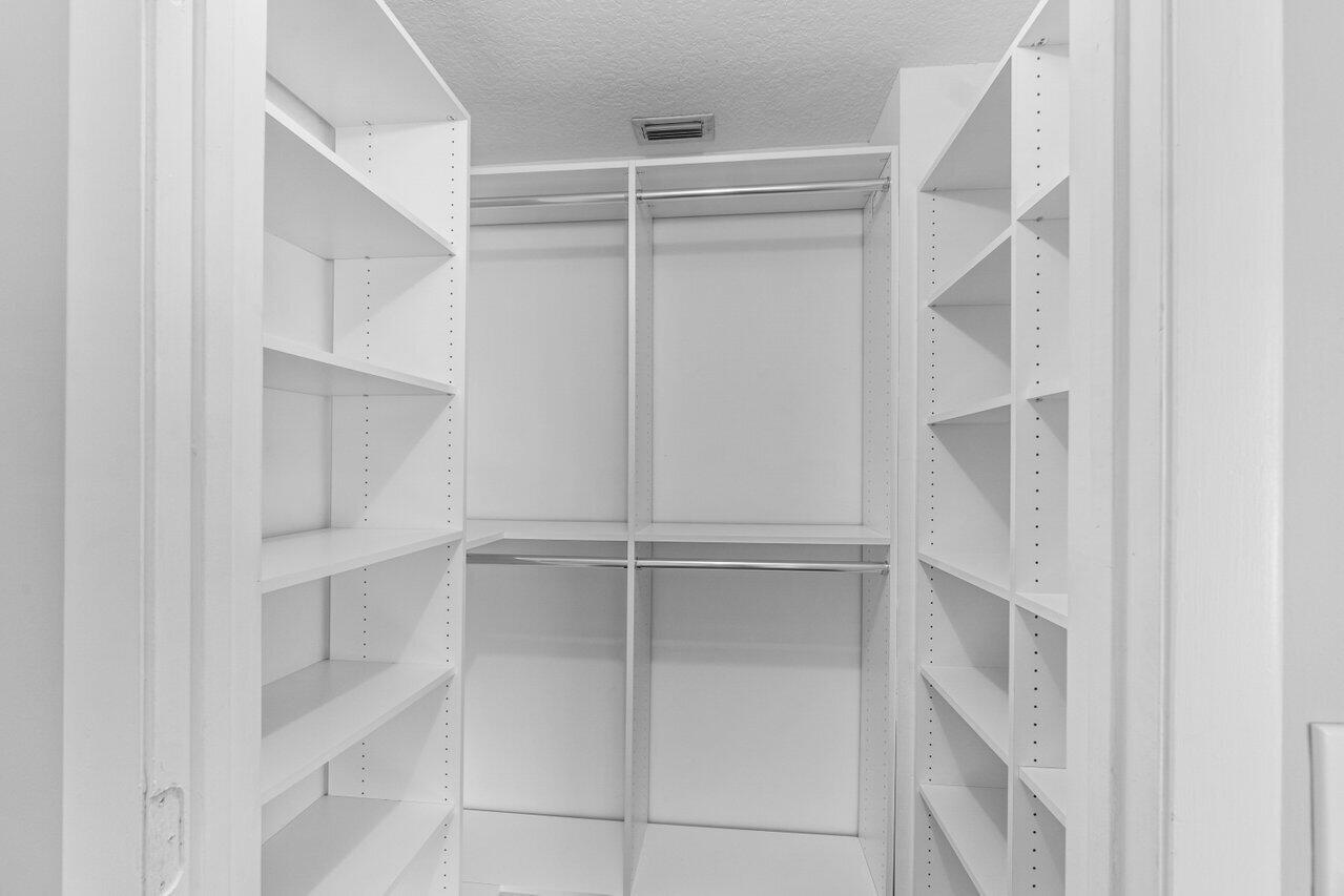 23458 Torre Circle Boca Raton, FL 33433 - Photo 30 of 36 a view of an empty walk in closet