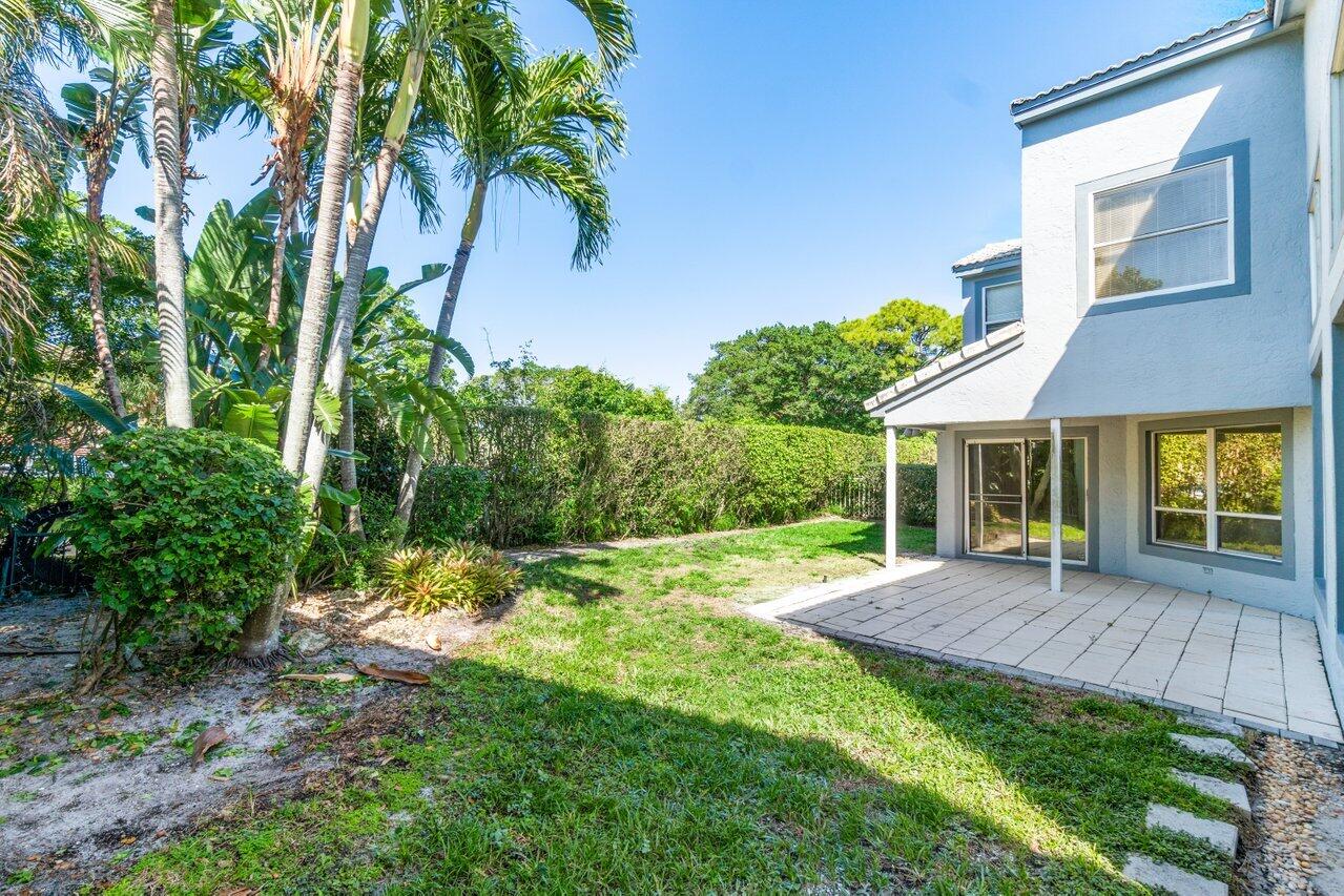 23458 Torre Circle Boca Raton, FL 33433 - Photo 33 of 36 a backyard of a house with seating space