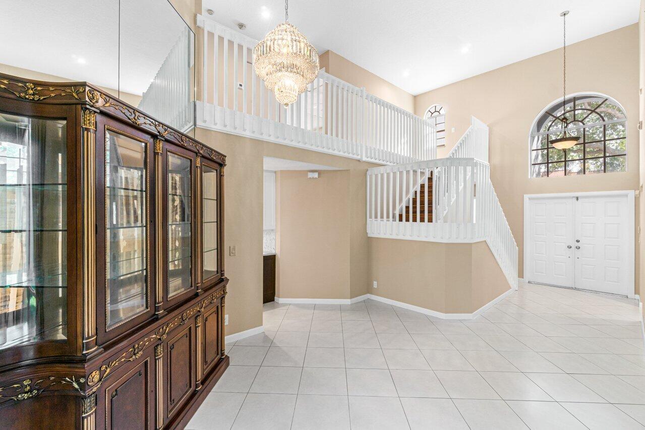 23458 Torre Circle Boca Raton, FL 33433 - Photo 4 of 36 a view of an entryway with wooden floor