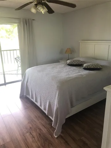 a view of a lake with houses in the back