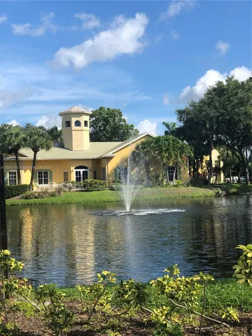 aerial view of a house with a lake view