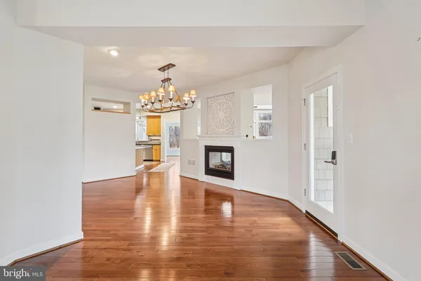 a kitchen with stainless steel appliances granite countertop a stove top oven a sink dishwasher a refrigerator and a microwave