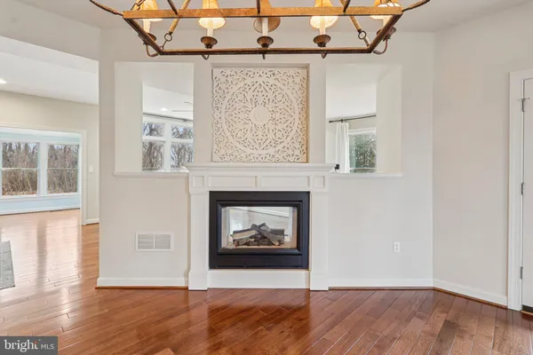 a kitchen with stainless steel appliances granite countertop a sink a stove and cabinets