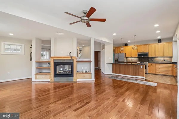 a view of an empty room with a fan
