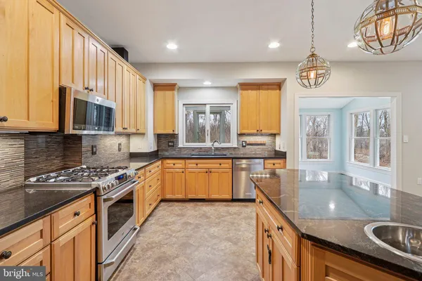 a view of an empty room with a ceiling fan