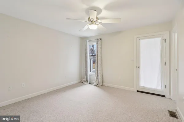a view of a garage with wooden table and chairs