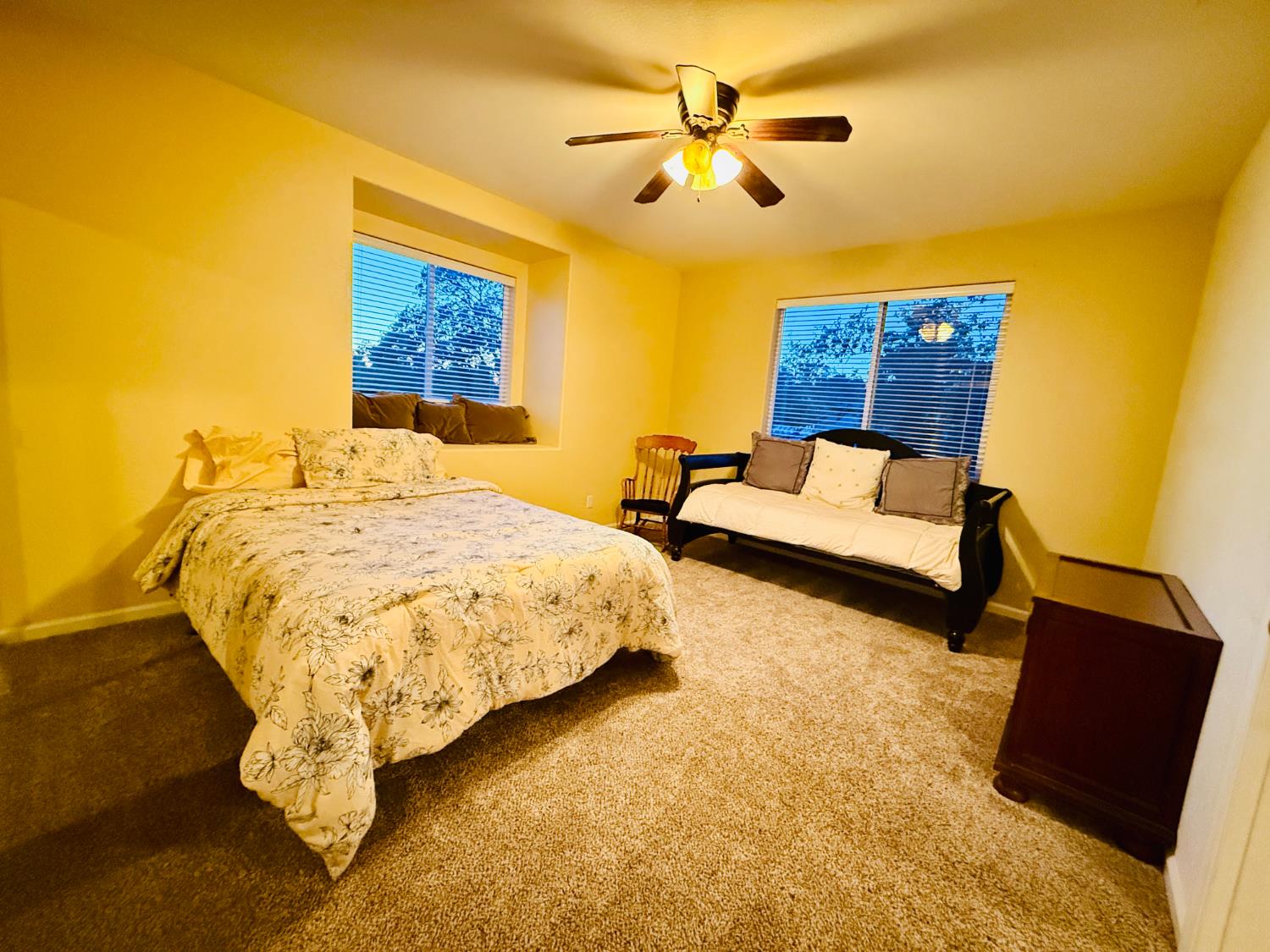 611 Sunrise Road Copperopolis, CA 95228 - Photo 22 of 29 a bed sitting in a bedroom next to a window with a workspace