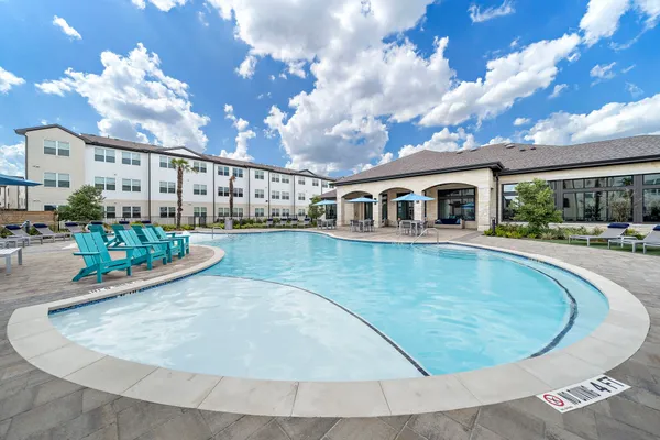 swimming pool view with plants and lake view