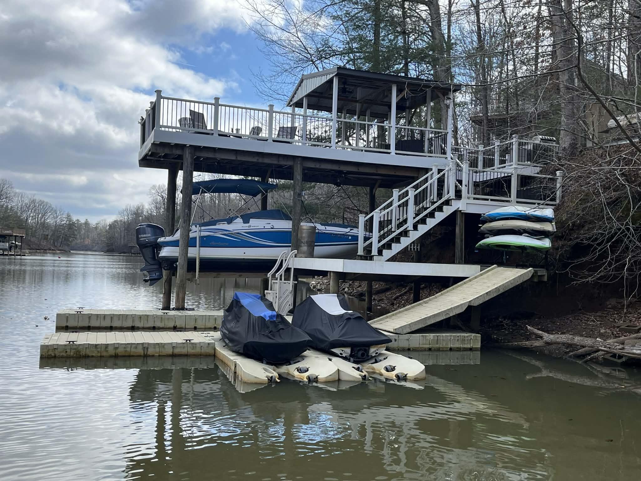 a view of house with wooden deck and living room
