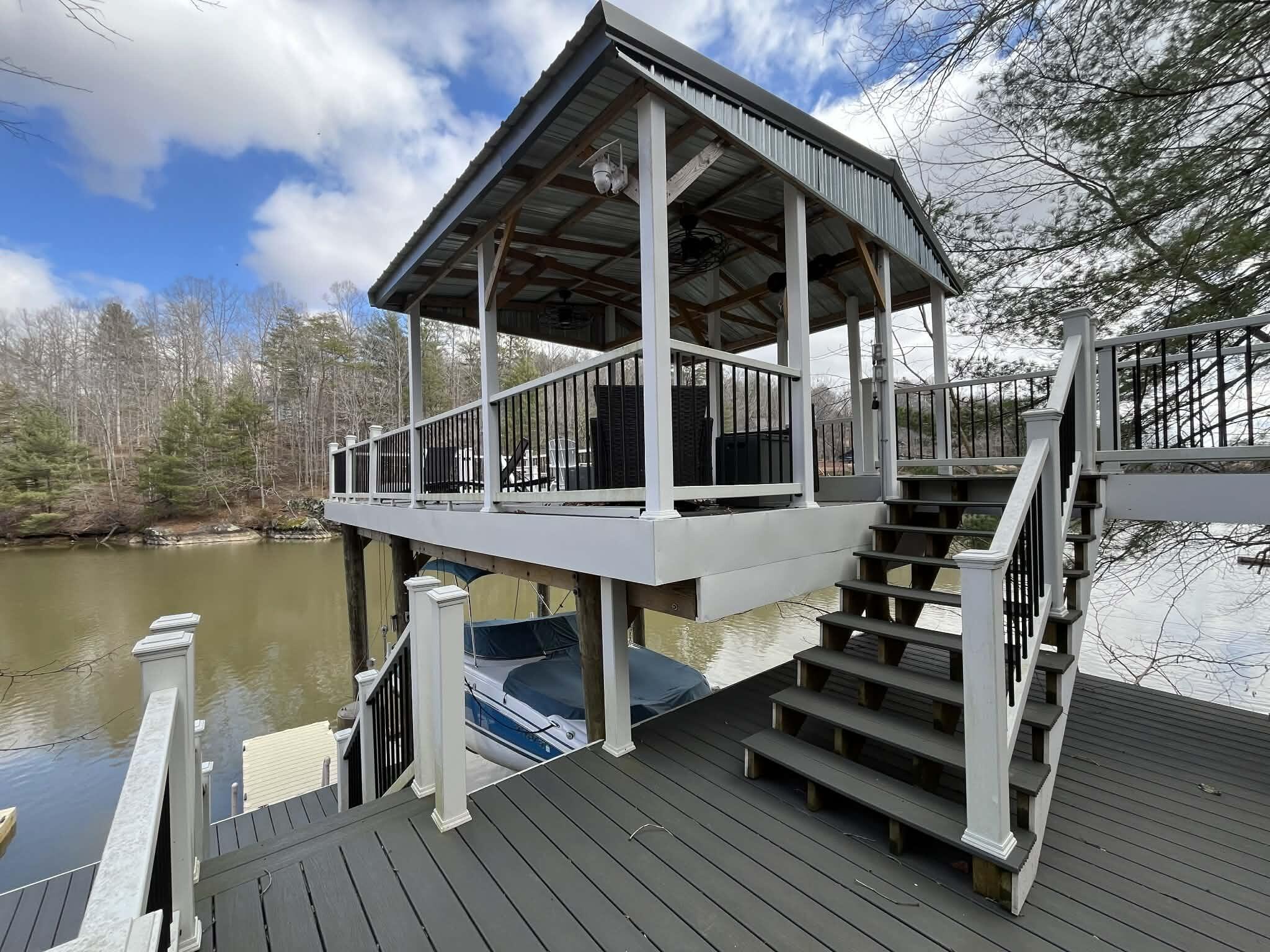 512 Ridgelake Road Goodview, VA 24095 - Photo 3 of 17 a view of a two chairs and table on the deck