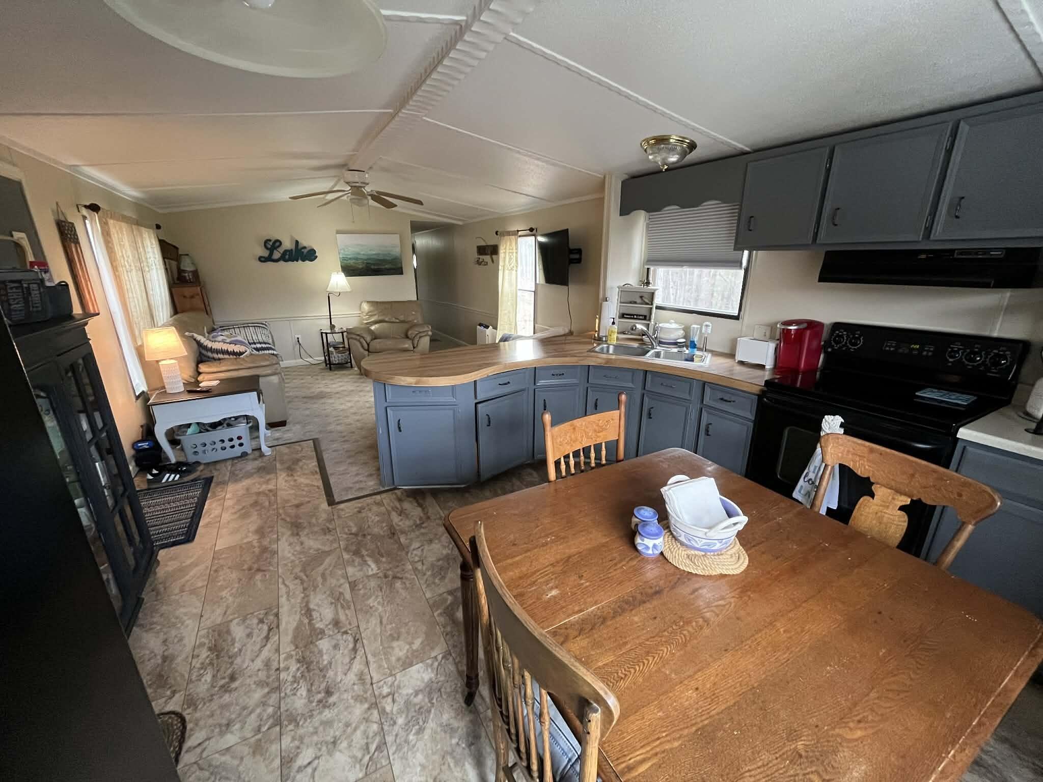 512 Ridgelake Road Goodview, VA 24095 - Photo 8 of 17 a kitchen with a table and chairs in it