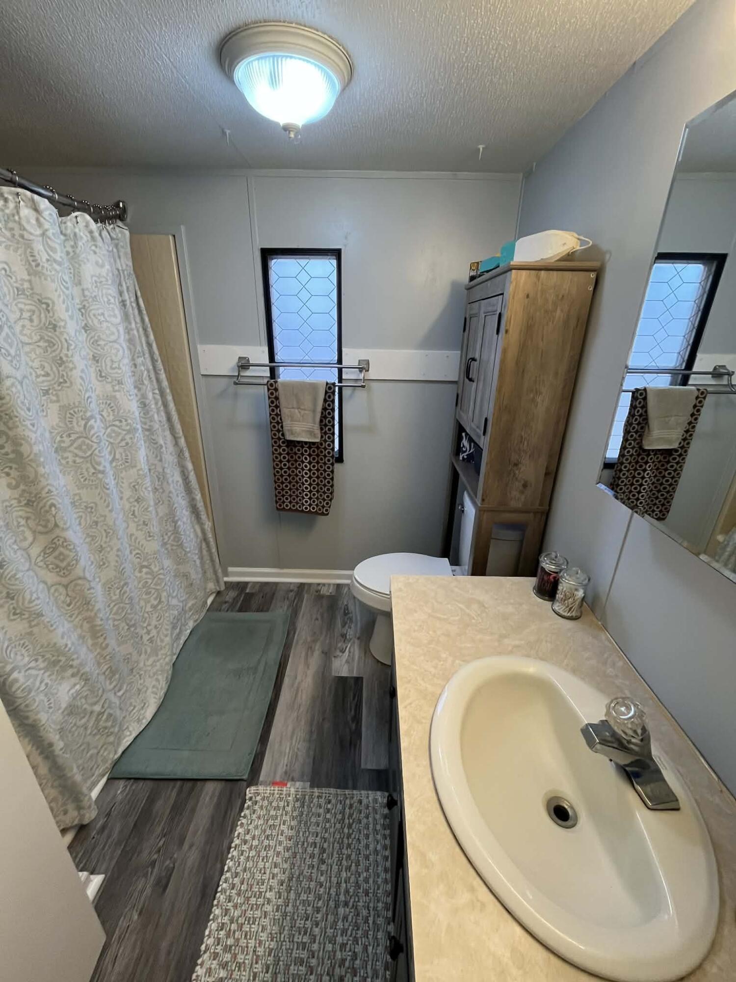 512 Ridgelake Road Goodview, VA 24095 - Photo 10 of 17 a bathroom with a sink and mirror